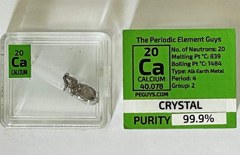 Calcium Metal Crystal 99.9% in oil in glass ampoule in a Periodic Element Tile - The Periodic Element Guys
