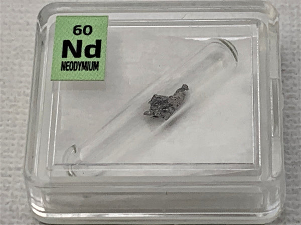 Neodymium Metal in Glass ampoule under argon, Clean and Shiny  99.9% in a Periodic Element Tile - The Periodic Element Guys
